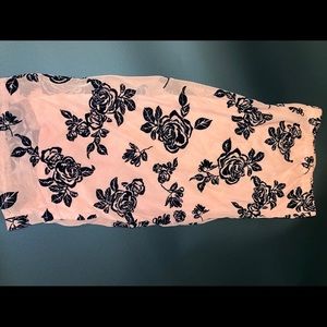 Salmon pink tube dress with black roses.